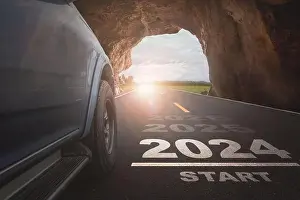 Happy New Year 2024, 2024 symbolizes the beginning of a new year. The beginning of cars running on the road with sunset light goal of success
