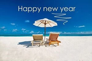 Images Dated 7th May 2018: Happy new year written in the sky. Artistic summer beach holiday with new years eve concept