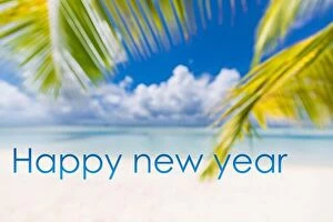 Images Dated 8th May 2018: Happy new year written in the sky. Artistic summer beach holiday with new years eve concept