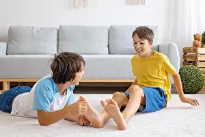 Happy positive children, tickling on the feet