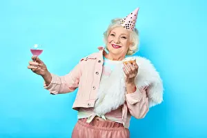 Unrecognizable Prints: happy positive funny senior woman having fun in the party