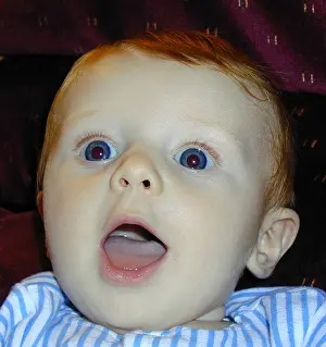 Infants Prints: Happy Red headed baby boy smiling with blue eyes