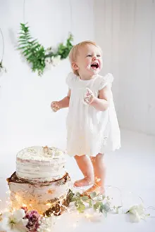 Barefoot Prints: Happy toddler girl eating cake
