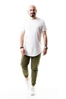 Sneakers Prints: Happy walking bald bearded man in olive green pants and blank white shirt