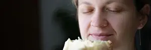 Housewife Prints: Happy woman with closed eyes holding white bread