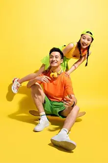 Weekend Activities Prints: Happy young couples play skateboard
