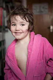 Self Assured Prints: Happy young girl smiling in bathrobe with short wet hair at home