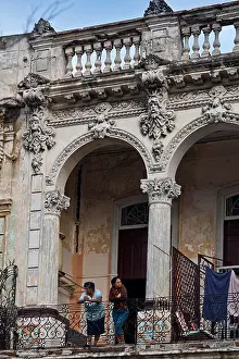 Balconies Prints: Havana residents on balcony Spanish colonial architecture