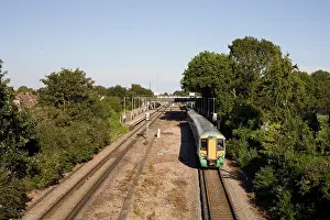 Coastal Town Prints: Havant railway station with class 377 electrostar in Southern livery en route to Portsmouth on a warm August afternoon
