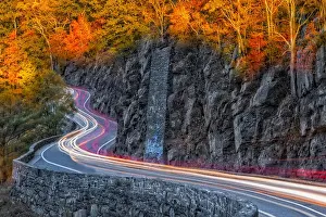 Winding Prints: Hawks Nest Road - Car trails along the winding road during autumn in Port Jervis, New York