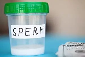 Health. Sample sperm. Donor Sperm Close Concept of Bank Sperm. Sperm on Blue Background