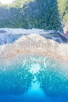 Aerial Landscape Collection: Healthy coral reefs surround a remote island in Indonesia's Banda Sea