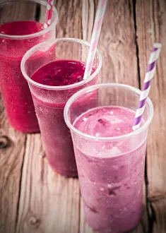 Icecream Prints: Healthy delicious trio of different berry smoothies with low fat yogurt arranged in a diagonal row