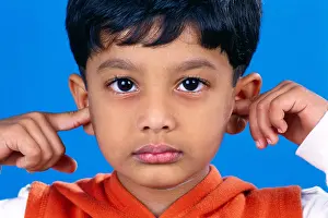Camera Prints: Hear No Evil ; Indian boy child with hands on his ears ; India ; Asia ; MR#152