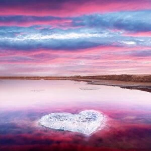 Images Dated 13th September 2020: Heart from salt in pink water salt lake in Ukraine, Europe. Creative concept