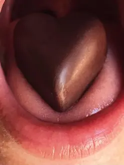 Tasting Prints: Heart shaped chocolate on a human tongue