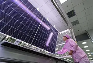 Photovoltaic Prints: HEFEI, CHINA - SEPTEMBER 15, 2022 - A worker produces solar photovoltaic module products at a production line in Hefei