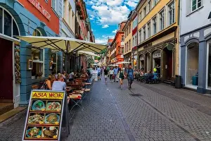 River Neckar Prints: Heidelber, Germany - July 6, 2019: Marketplace crowded with tourists and Town Hall in Heidelberg in Germany