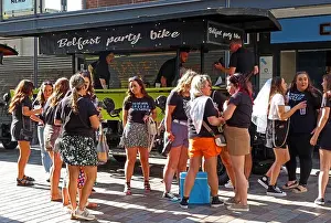 Parties Prints: Hen Party of young women, boarding a Belfast party bike