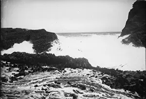 Beach Landscape Prints: Henry Winkelmann's 1909 photograph of Piha's The Gap captures the dramatic scene of breaking waves