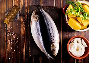 Salted Prints: Herring or Baltic herring with salt on dark backgruond