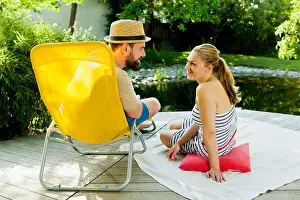 Heterosexual Prints: Heterosexual couple takes a break by the pond, Munich, Bavaria, Germany
