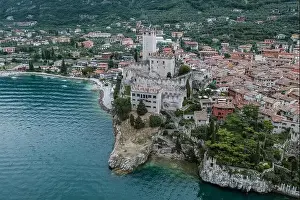 Lake Garda Prints: High angle aerial drone shot view of Castello Malcesine village in Italy