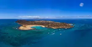 High Aspect Aerial Panorama of the Tropical looking Volcanic island of Lobos Fuerteventura