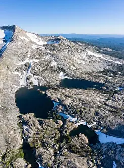 High granite mountains surround beautiful lakes in the Desolation Wilderness, California. This mountainous area is a popular backpacking destination