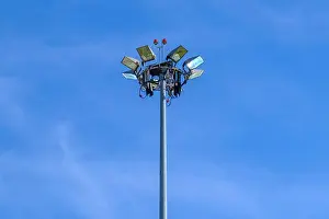 Lamppost Prints: High mast lighting in airport on blue sky background