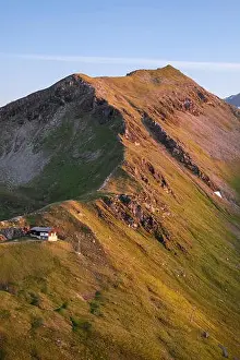 High mountain peak with sunset sunlight at summer evening in Austria, Alps