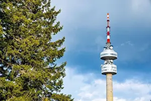 Snezhanka Tower Prints: The high tourist observation tower Snezhana on the mountain peak of Snezhana covered with evergreen spruce dense