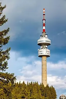 Snezhanka Tower Prints: The high tourist observation tower Snezhana on the mountain peak of Snezhana covered with evergreen spruce dense
