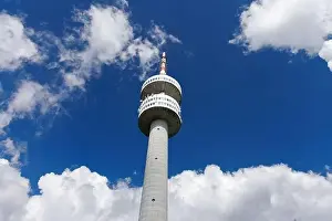 The high tourist observation tower Snezhana on the mountain peak of Snezhana covered with evergreen spruce dense