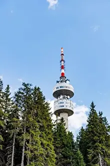Snezhanka Tower Prints: The high tourist observation tower Snezhana on the mountain peak of Snezhana covered with evergreen spruce dense