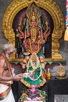 Singapore Prints: Hindu deity and priest, Sri Veeramakaliamman Hindu temple, Singapore, Asia