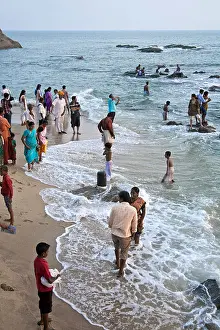 Karma Prints: Hindu pilgrims bathing in the ocean. Kanyakumari. Tamil Nadu. India