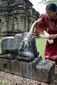 Worshiping Prints: Hindu woman offering milk to a Nandi Bull (the vehicle of God Shiva)