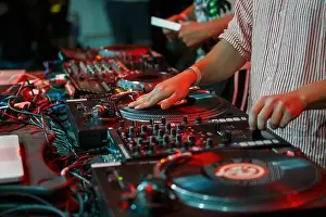 Turntable Prints: Hip hop dj scratches vinyl record on party in night club