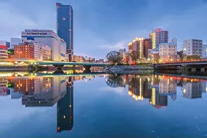 Water Blue Prints: Hiroshima, Japan downtown cityscape on the Enko River at twilight