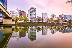 Hiroshima, Japan downtown cityscape on the Enko River at twilight