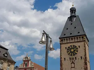 Historic Quarter Prints: Historic clock tower and bells in front of a cloudy blue sky, speyer, germany