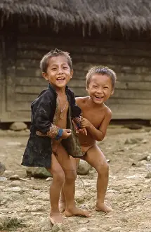 Poverty Prints: Hmong children playing in their village near Chang Rai Thailand