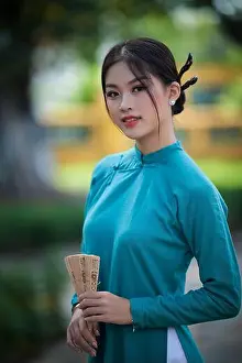Ho Chi Minh City Prints: Ho Chi Minh city, Viet Nam: Vietnamese girl going to pagoda in ao dai