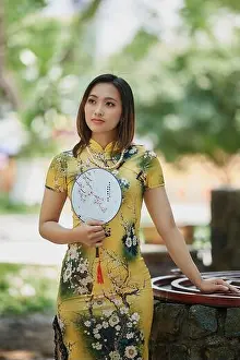 Black Beauty Prints: Ho Chi Minh city, Viet Nam: Two Vietnamese girls with cheongsam costumes go to the temple