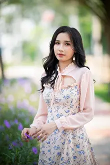 Vogue Prints: Ho Chi Minh City, Vietnam: Beautiful Vietnamese girl walking in the park with a long skirt