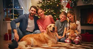 Golden Retriever Prints: Holiday Portrait of a Loving Family Posing for Camera