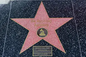 Blvd Prints: HOLLYWOOD, CA - DECEMBER 06: The Recording Academy star on the Hollywood Walk of Fame in Hollywood