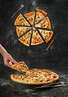 Pizza Prints: Home made original italian pizza with human hand holding pizza slice
