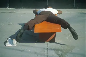 Fatigue Prints: Homeless black man sleeping on a park bench New York City New York